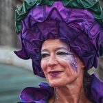 focus photography of woman in purple hat
